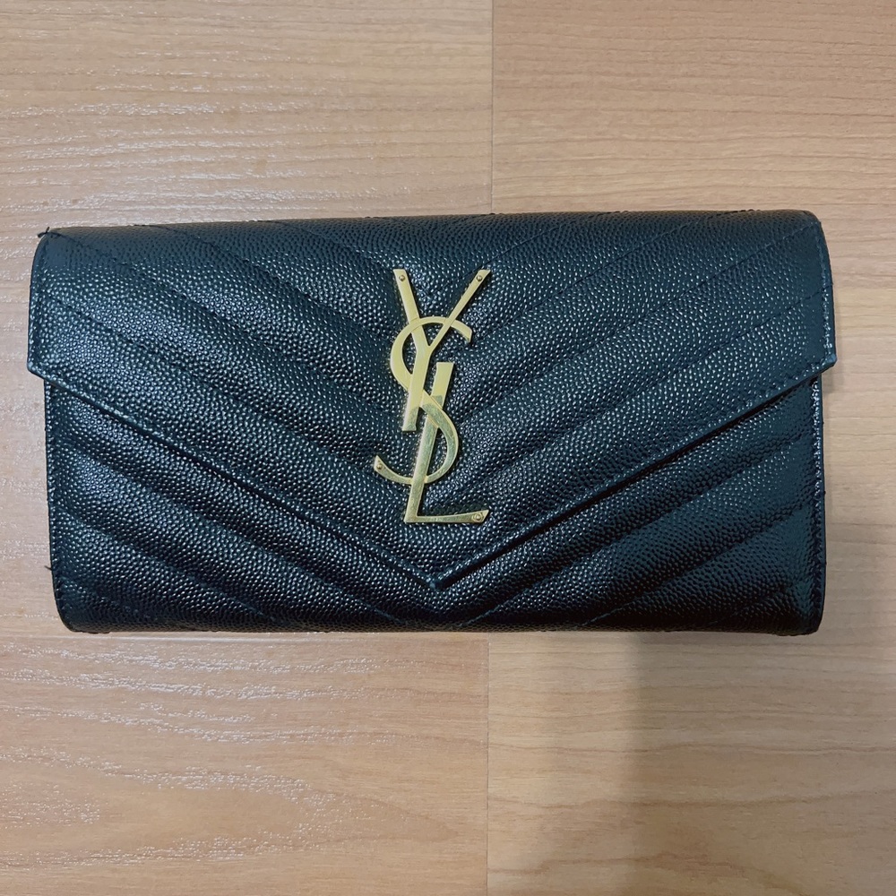 Saint Laurent Monogramme Leather Flap Wallet with goldtone.